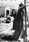 A survivor mourning in the aftermath of the 1929 massacre in Hebron