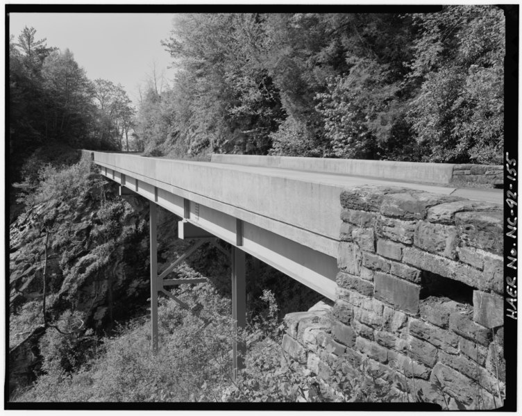 File:Humpback Mountain Viaduct. This steel girder viaduct, built in 1940, has the unusual feature os solid concrete railings. View shows the steel piers built upon a very steep HAER NC,11-ASHV.V,2-155.tif