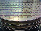 Semiconductor wafers, showing IPtronics designed ICs for parallel optical interconnects using a STMicroelectronics fabrication process IPtronics - Parallel Optical Interconnects - STMicroelectronics wafers.jpg