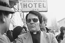 Jim Jones in front of the l-Hotel in January 1977 JIM JONES in 1977.jpg