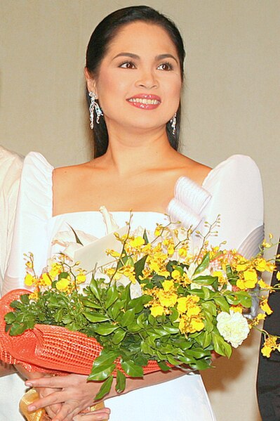 Judy Ann Santos portrays Angelita "Angie" Mariano-Valeriano.