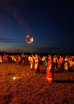 Russian Rodnovers engaged in a ritual with a fiery wheel. Kupala 2017 in Krasotinka, Kaluga (0).jpg