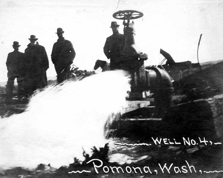 File:Large well spouting water with four men watching, Pomona, ca March 1913 (INDOCC 1347).jpg