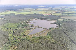 in the foreground the Lugkteich, in the background the Sonnewald district of Zeckerin (June 2013)