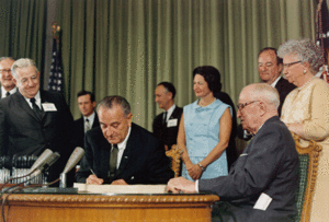 English: Photograph of President signing the M...