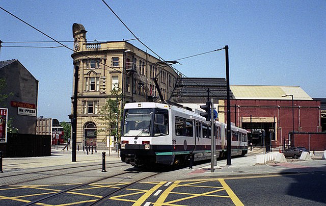 An AnsaldoBreda T-68 tram emerges into the streets from Manchester Victoria station in June 1992
