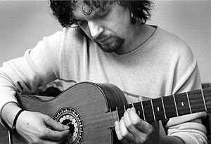 Young man playing a guitar