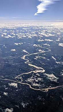 Aerial view of the Mohawk River, with Troy and the Hudson River in the foreground, and Schenectady in the background
