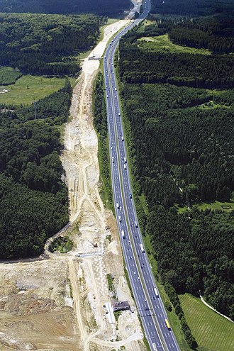 Construction of the route through the Kosching forest, north of Ingolstadt, Germany, had a large environmental impact but with Road-Rail Parallel Layout this would be less than using multiple routes. NIM Baustelle2001 Leidorf Koeschinger Forst.jpg