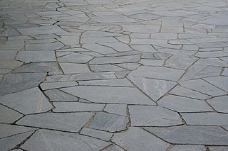 Crazy paving Means of hard-surfacing used outdoors, most often in gardens