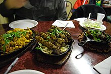 A variety of Pakistani dinner dishes - Starting from the left: gobi aloo, seekh kebab, and beef karahi Pakistani gobi aloo, seekh kebab, and beef karahi.jpg