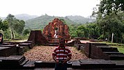 Thumbnail for File:Posing against the large temple undergoing restoration (31764637576).jpg