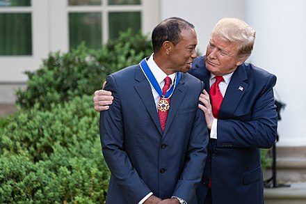 Tiger Woods receiving the Presidential Medal of Freedom from President Donald Trump in May 2019
