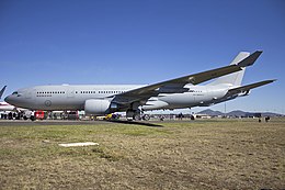 Grey-coloured twin-engined jet on runway