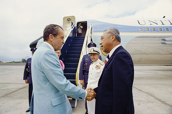 President Richard Nixon shaking hands with Senator Hiram Fong prior to departing for Guam from Kaneohe Marine Corps Air Base on February 20, 1972