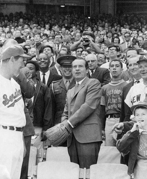 U.S. President Richard Nixon throwing the Opening Day ceremonial first pitch at RFK Stadium on April 7, 1969, with Ted Williams (left) and Bob Short (