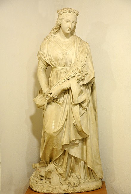 Saint Philomena with attributes: palm branch, whip, anchor and arrows. Plaster cast by Johann Dominik Mahlknecht in the Museum Gherdëina in Urtijëi, Italy