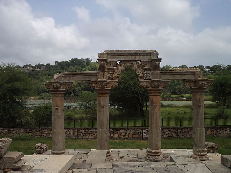 File:Sas bahu temple's back entrace with stone columns with carving.jpg