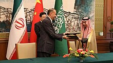 Iranian Foreign Minister Hossein Amir-Abdollahian and Saudi Foreign Minister Faisal bin Farhan Al Saud after signing a joint statement on the restoration of diplomatic relations, with Chinese Foreign Minister Qin Gang in the background, 6 April 2023 Saudi-Iran joint statement signing (2023).jpg