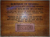 Inscription: Borough of Bexhill. This shelter has been generously donated by David Macbeth of Cooden to provide means of rest and to give comfort to blind persons visiting this scented garden. Members of the public are therefore kindly requested to give the blind precedence in the use of this shelter March 31st 1952.