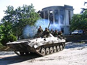 Tank-like vehicle with soldiers aboard