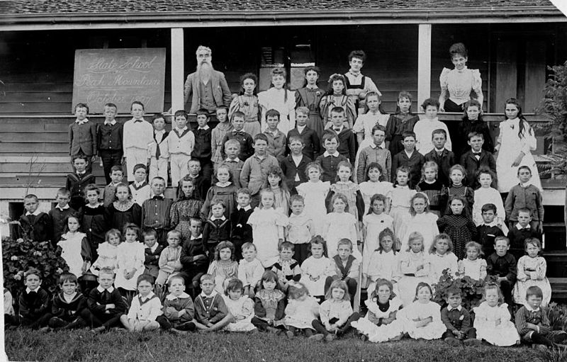 File:StateLibQld 2 123932 Children from the Peak Mountain State School pose for their photograph in front of the school building in 1897.jpg