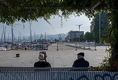 Two men sitting on a bench, Vigo Port, Galicia, Spain