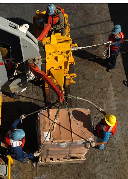 File:US Navy 050109-N-8629M-074 Civilian Mariners aboard the Military Sealift Command combat store ship USNS Concord (T-AFS 5) prepares pallets to be transferred to the fast combat stores ship USNS Rainier (T-AOE 7) during a repleni.jpg