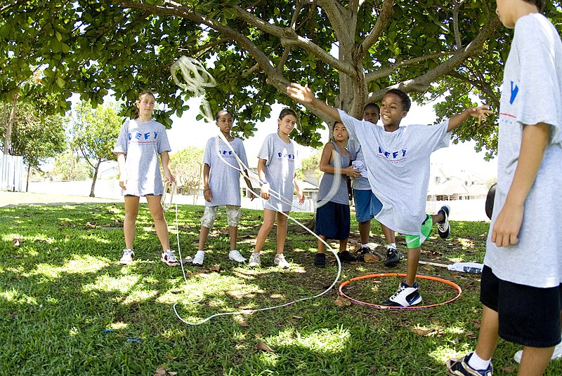 File:US Navy 070719-N-6674H-067 A child enrolled in the drug education for youth (DEFY) phase-one summer camp tosses a line to a volunteer mentor during a team building exercise at the Caitlin Community Center at Naval Station Pearl.jpg