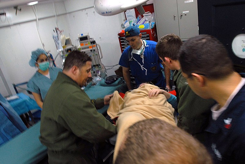 File:US Navy 071215-N-3659B-234 Medical personnel aboard the aircraft carrier USS Ronald Reagan (CVN 76) help transport a patient into the ship's operating room.jpg