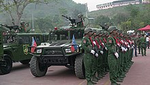 UWSA troops standing at attention during a military ceremony. UWSA soldiers stand at attention during ceremonies.jpg