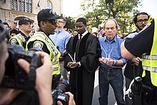 Harvard Professor Jonathan L. Walton with more than 30 fellow faculty members during a protest in Cambridge against the repeal of the DACA program. Walton.Protest1.jpg