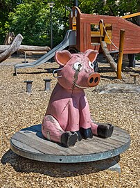 Wooden pig merry-go-round in Brastad