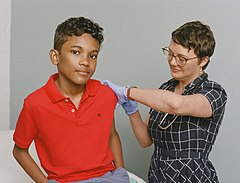 Young boy receiving a vaccine (48545943301).jpg