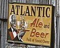 "ATLANTIC ALE and BEER" "Full of Good Cheer" sign, from- African American migratory workers by a 'juke joint'. Belle Glade, Florida, February 1941 (cropped).jpg