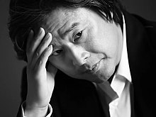 Park Chan-wook, the director of Thirst (2009), one of the many varied Korean horror films from the early 21st century. 20130925--Park Chan-wook bagcanug Marie Claire Korea photo shoot screenshot (00m01s) (cropped).jpg