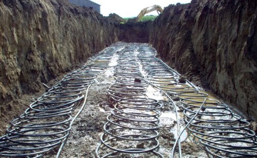 A horizontal slinky loop prior to being covered with soil.