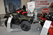 An electric spreader on a quad