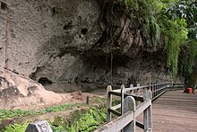 The rock wall where the Angono Petroglyphs can be found. The site is considered as a dambana due to the presence of ancient figures drawn on the rock walls for healing purposes. It was rediscovered only in 1965. Angono Petroglyphs.jpg