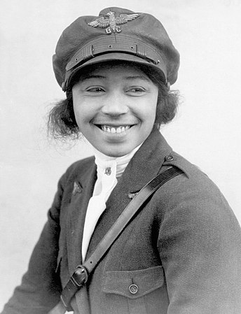 Bessie Coleman was a bit under half Native American, a little over half African-American, and a woman. D'ye know which of those were allowed to become a pilot in America at the time? None of them. So she saved up money, went to France, and became one anyway. Nominated by Coffeeandcrumbs.