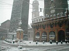 The towers and the statue of Saint Petronius covered with snow. Bologna-San Petronio statua with snow.jpg