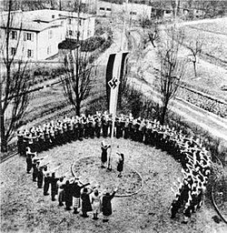 Flag raising at a KLV camp Bundesarchiv Bild 146-1983-056-13, Kinderlandverschickung, Flaggenappell im KLV-Lager.jpg