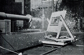 The first chicken gun, built in 1942, being fired at a glass panel