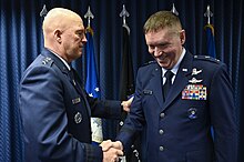 Gen Raymond shakes Bratton's hand after his promotion to major general, March 2022 CSO Raymond promotes Brig. Gen. Shawn Bratton (14).jpg