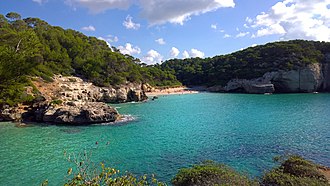 Beach of Cala Mitjana Cala Mitjana (29503984994).jpg