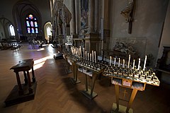 Candles and offerings in the Chiesa de Santa Catarina, Siena, Italy