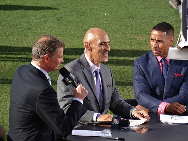 Patrick (left) along with colleagues Tony Dungy and Rodney Harrison at an NFL game in Denver in September 2013.