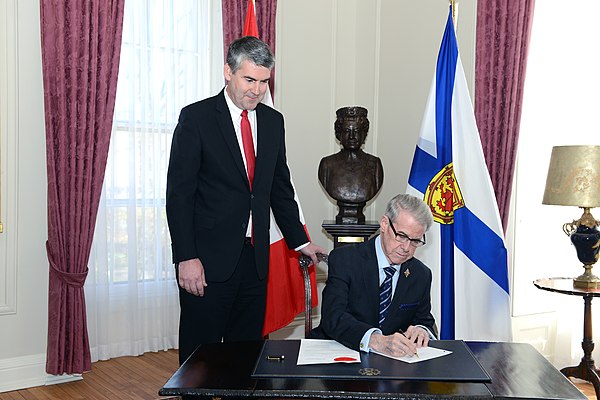 Lieutenant Governor of Nova Scotia, Brigadier-General the Honourable J.J. Grant, signing the Order in Council dissolving the Provincial House of Assem