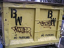 Spray paint graffiti tags on a dumpster with the owner's markings spray painted using a stencil. New York City, 2007. DumpsterPaint.jpg