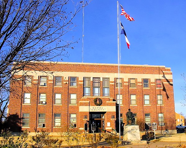 A statue of C. W. Post in front of the Garza County Courthouse